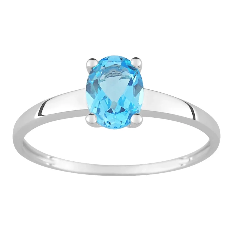 Bague Or Blanc 750/1000 et Topaze Bleue Ovale 7x5mm Sertie 4 Griffes